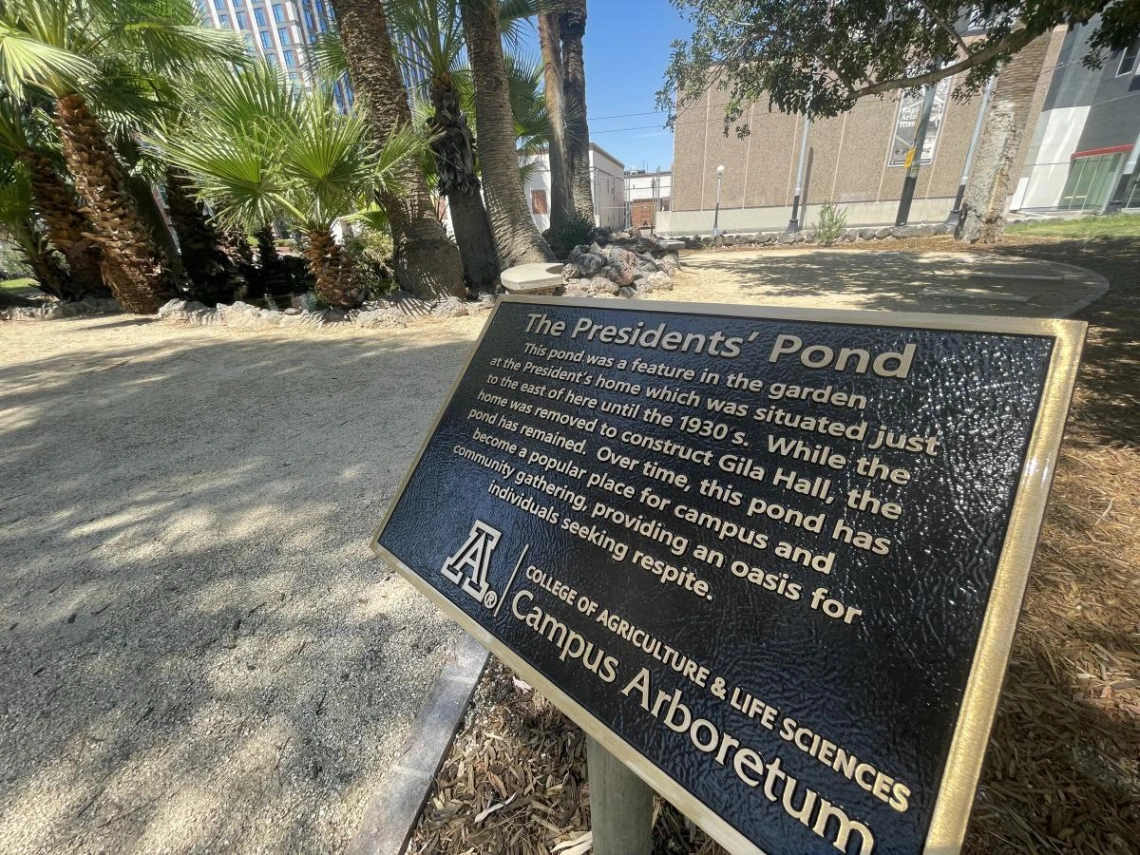 The bronze interpretive plaque installed at the top of the entry path Summer 2023.